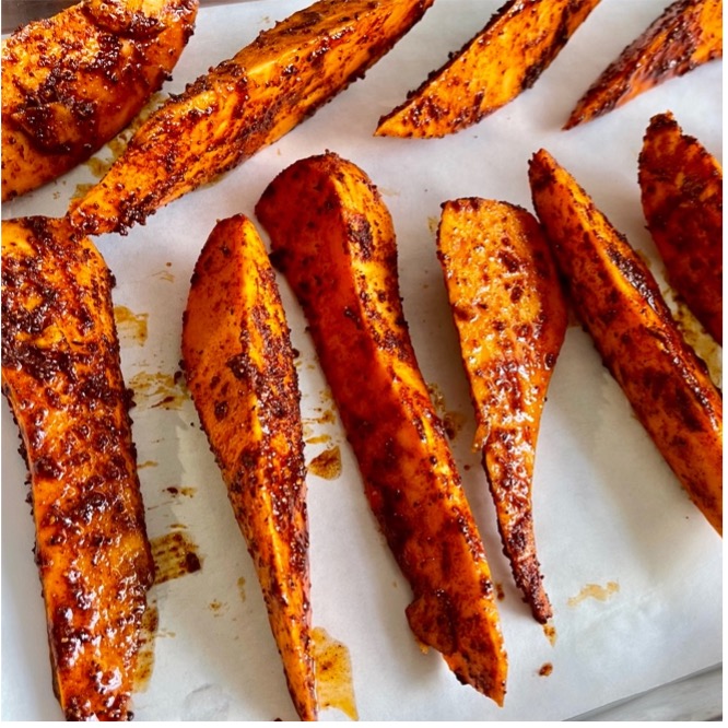 Image of In a bowl, toss the sweet potato, Cataluña spices, salt and olive oil to coat evenly.